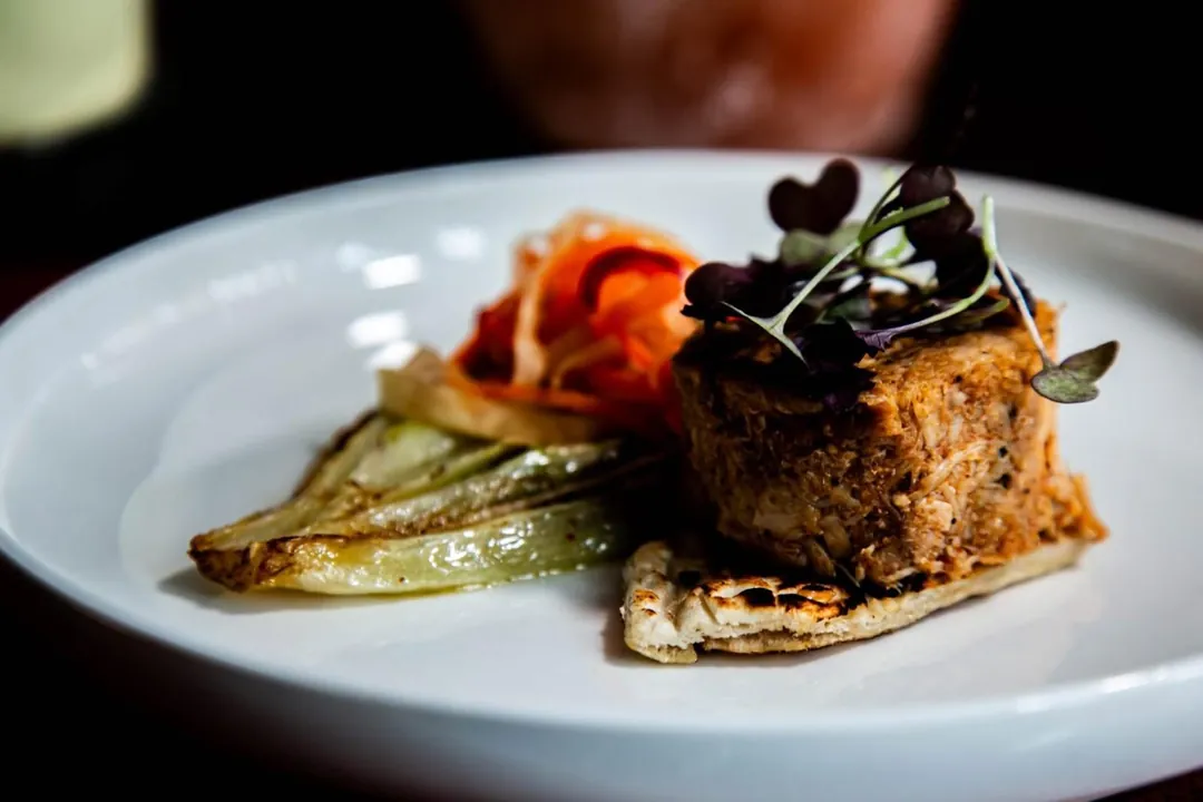 A plated fillet with braised fennel and herbs
