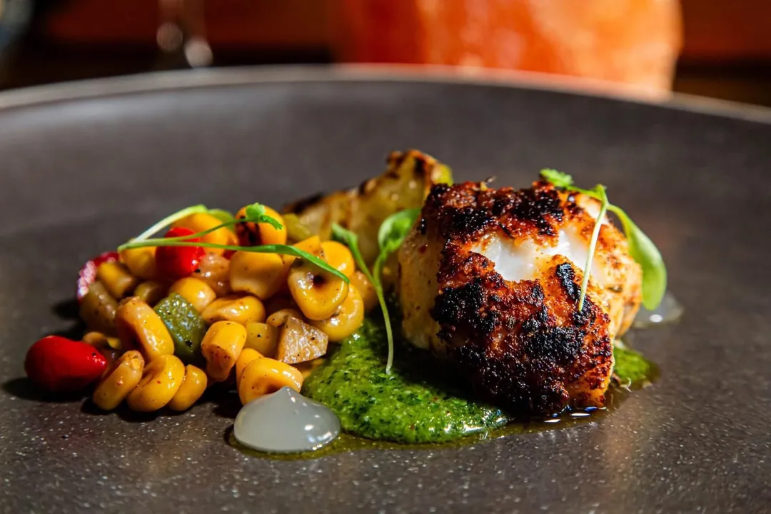 A seared scallop with a sweetcorn and pepper salsa